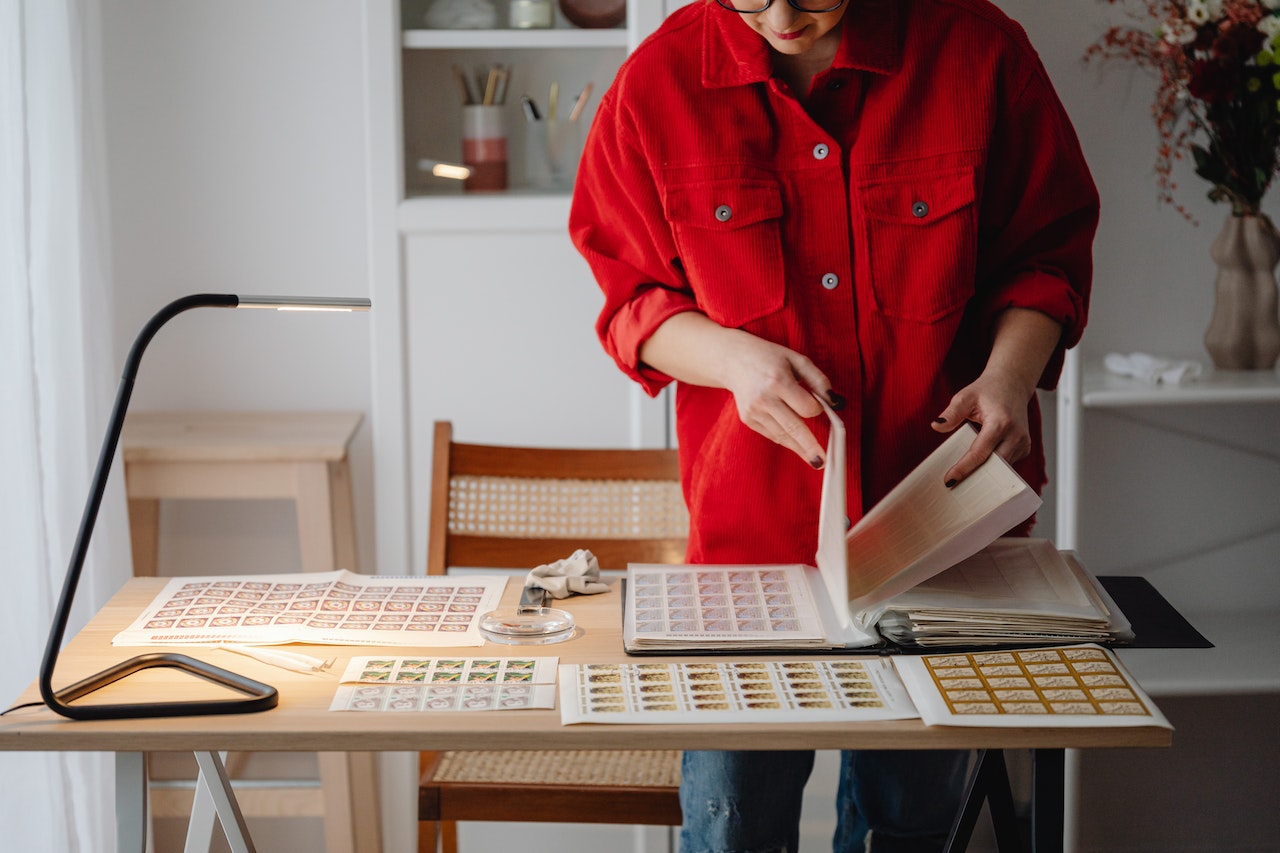 Woman with a stamp collection