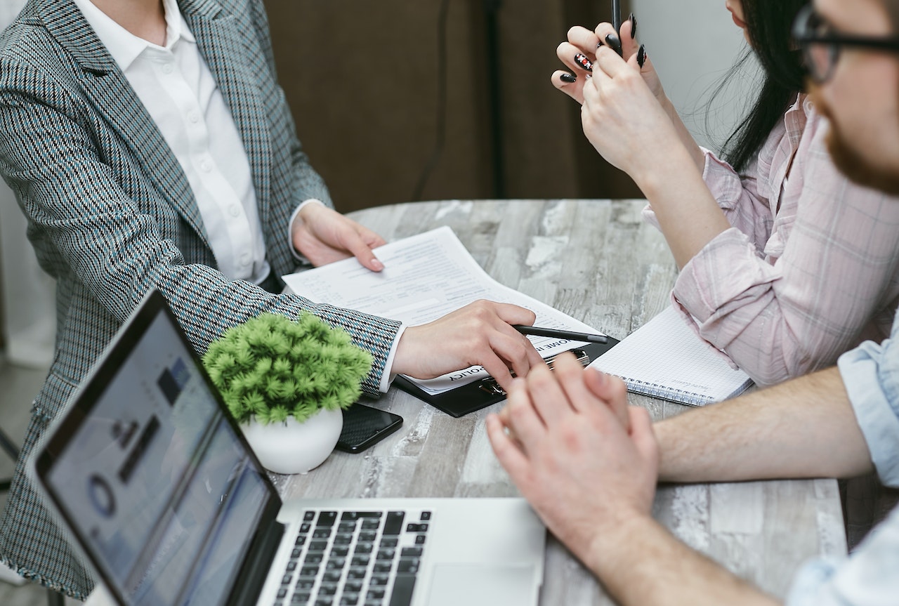 people discussing an insurance contract